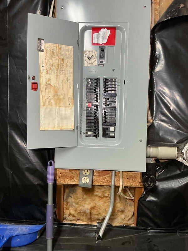 Diagnosed a no-heat condition on a 25+ year old gas furnace: the inducer motor was running but the hot surface igniter never energized, indicating a pressure switch circuit problem. Shut down the unit and cleared a restriction in the pressure switch tubing by blowing compressed air through the line to the inducer housing. Restored power, and the furnace completed its full ignition sequence with stable burner flame and is now heating properly.