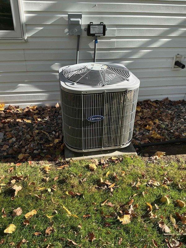 Performed seasonal maintenance on a 13-year-old furnace and 11-year-old Carrier air conditioning system. On the furnace, cleaned the flame rod and verified HSI resistance and blower motor amp draw within specification; inducer motor amp draw measured slightly above spec, heat exchanger showed minor surface rust with no cracks, CO measured 47 ppm, and the unit was confirmed heating properly. At the condenser, inspected the coil and component box (clean, free of dust and debris), confirmed capacitor and contactor were in good condition, and checked amp draw at the fan; cooling operation was not tested due to low ambient temperature (approx. 45°F).