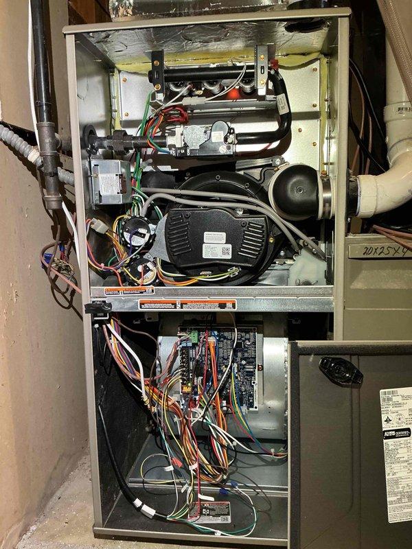 Responded to a no-heat call on a natural gas furnace and found the gas valve slide switch in the OFF position, which had been set manually after the customer shut the unit down in response to a thermostat alert. Returned the gas valve to the ON position, verified ignition and flame establishment, and confirmed the furnace is operating normally and producing heat.