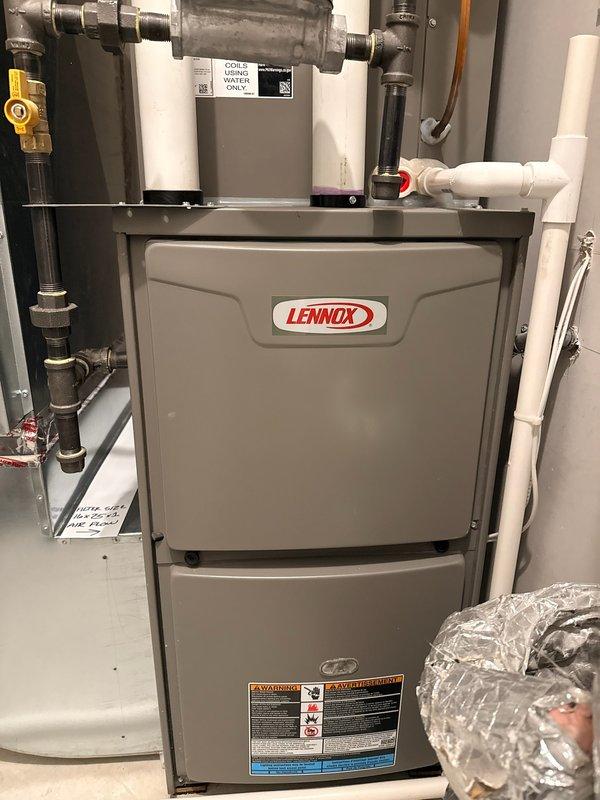 Diagnosed a Lennox gas furnace producing a loud knocking noise during operation and found a failing inducer motor along with corroded burners. Replaced the inducer motor assembly and gas burners, then verified quiet operation, proper ignition, and normal heating output.