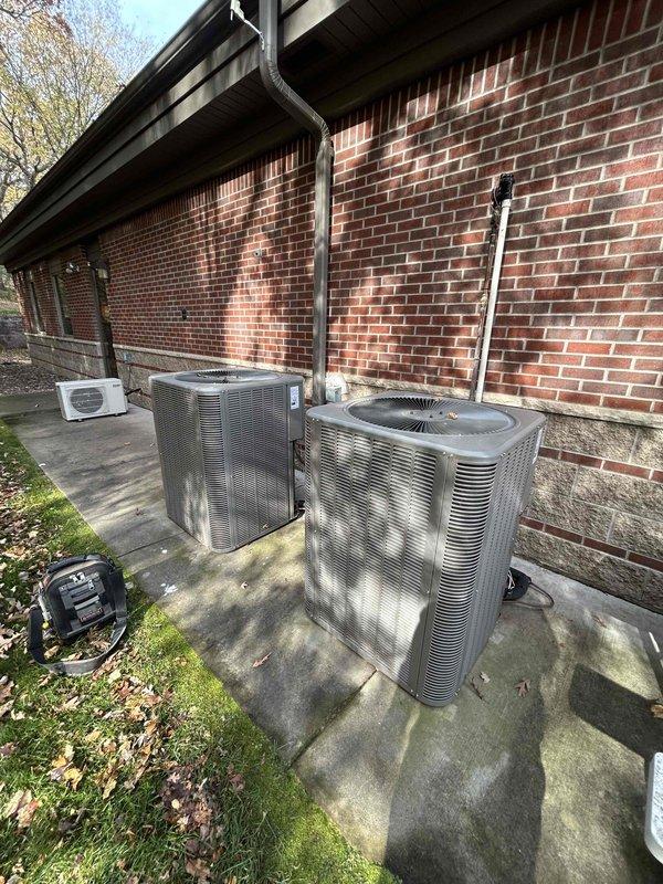 Performed IAQ/humidity diagnostic on both split-system A/C units, verifying clean air filters, proper blower speed settings, and clean evaporator and condenser coils. Measured temperature split (Delta T) at 20.7° on the west unit and 25.4° on the east unit, both within acceptable range, with evaporator coils sweating fully, confirming proper moisture removal. Refrigerant charge was not adjusted due to low ambient temperature (~54°F); both systems operating normally with no deficiencies found at time of service, though light frost was noted on the evaporator return bends and tubing.