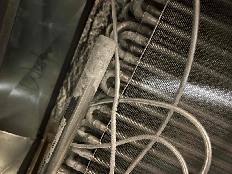 Performed IAQ/humidity diagnostic on both split-system A/C units, verifying clean air filters, proper blower speed settings, and clean evaporator and condenser coils. Measured temperature split (Delta T) at 20.7° on the west unit and 25.4° on the east unit, both within acceptable range, with evaporator coils sweating fully, confirming proper moisture removal. Refrigerant charge was not adjusted due to low ambient temperature (~54°F); both systems operating normally with no deficiencies found at time of service, though light frost was noted on the evaporator return bends and tubing.