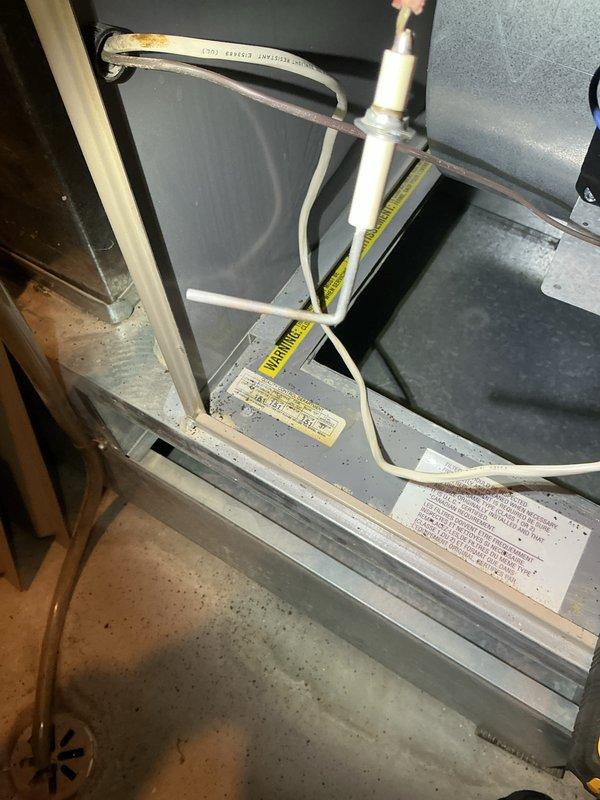 Performed a complete maintenance inspection on a 24-year-old 80% AFUE Amana gas furnace, including inspection of the filter, flame sensor/igniter assembly, and drain line. The heat exchanger was inspected and found to be in good condition, and all components checked out and operated properly, with no repairs required.