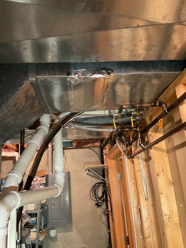 Diagnosed weak upstairs airflow on a gas furnace system and determined the cause to be an unbalanced duct system following removal of the original zoning dampers, likely compounded by restricted or undersized upstairs supply runs and an insufficient return-air path. Recommended either a properly designed two-zone replacement with motorized dampers, separate thermostats, and duct/return sizing verification, or manual balancing dampers at the former damper locations as a lower-cost option that improves airflow but does not provide automatic temperature control. A comfort advisor has been scheduled to provide quotes.