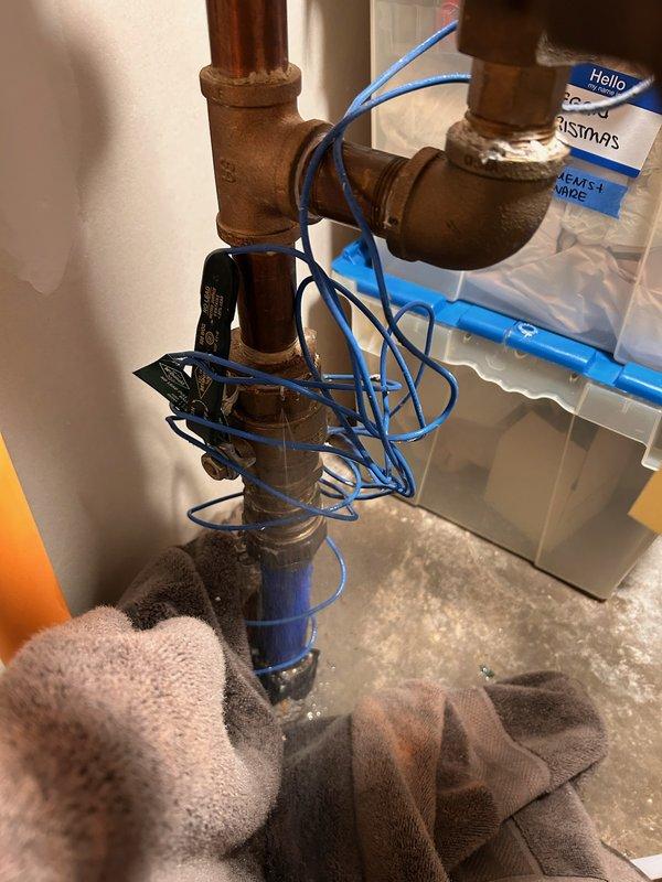 Responded to an active leak on the main water supply line and identified a pinhole failure in the 1.25" brass FIP ball valve as the source. Documented the condition with photos, provided repair estimates, and noted that scheduling and coordination are required to complete the valve replacement.