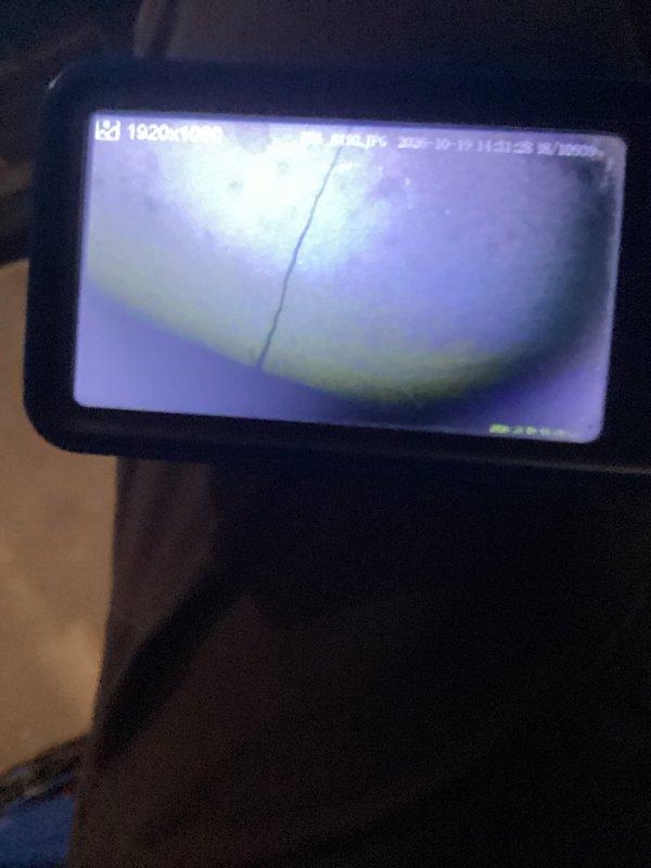 Responded to a no-heat call and performed a second-opinion inspection of the furnace installed in 2023, using a borescope to examine the heat exchanger. Imaging confirmed visible cracking in the heat exchanger, and the unit was documented as a warranty replacement candidate under the manufacturer's coverage.