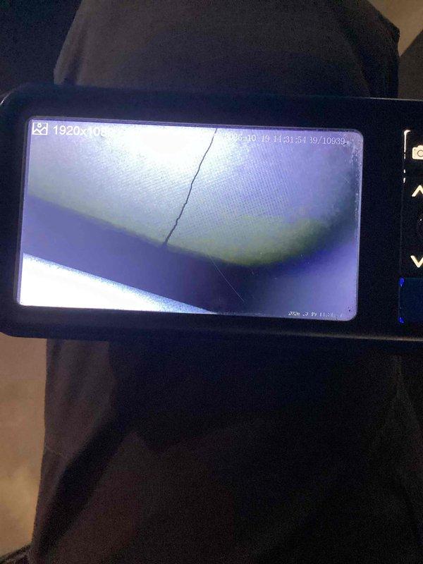 Responded to a no-heat call and performed a second-opinion inspection of the furnace installed in 2023, using a borescope to examine the heat exchanger. Imaging confirmed visible cracking in the heat exchanger, and the unit was documented as a warranty replacement candidate under the manufacturer's coverage.