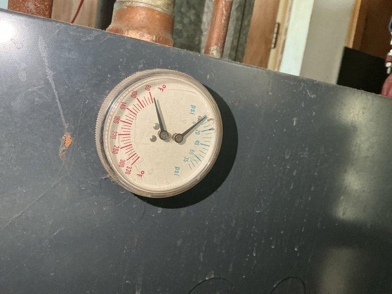 Responded to a no-heat call on a 50+ year old hydronic boiler and found the electrical breaker tripped; resetting it restored boiler operation. Flue gas analysis measured CO in excess of 1100 ppm, well above the 400 ppm maximum for vented heating appliances, so the unit was deemed unsafe to operate. Noted deteriorated, frayed pipe insulation and corrosion on the manifold piping and valves, and scheduled a same-day estimate for boiler replacement.