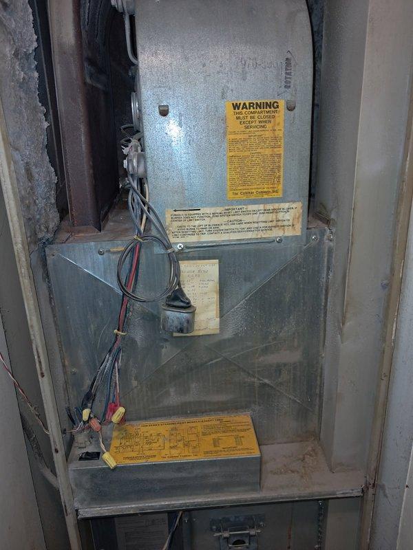 Diagnosed a no-heat condition on a 35-year-old Coleman 7975-856 standing-pilot mobile-home furnace. The pilot was proven, but the main burner would not ignite. The transformer tested good at 120 VAC primary and 29 VAC secondary, and the gas valve coil measured 64 Ω. An open limit switch near the blower motor was interrupting the heat circuit and preventing 24 VAC from reaching the gas valve. Due to the age and condition of the unit, the furnace was left off pending replacement consultation. If repair is elected, the limit switch must be replaced with the correctly rated safety component, followed by verification of a complete heating cycle and temperature rise.