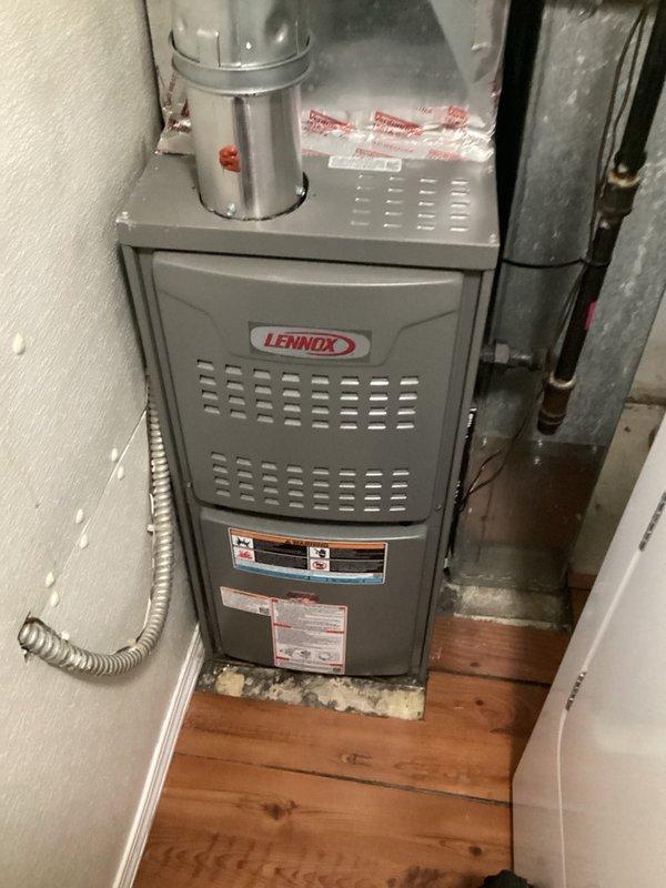 Responded to a complaint of loud, intermittent whirring noise from a Lennox ML180UH070E36AK upflow gas furnace during blower operation. Inspected the blower wheel, furnace cabinet, and ductwork for obstructions and found none; the noise was traced to the blower motor, which requires replacement. Replacement blower motor has been ordered, and the system remains operational for heating until the repair is completed.
