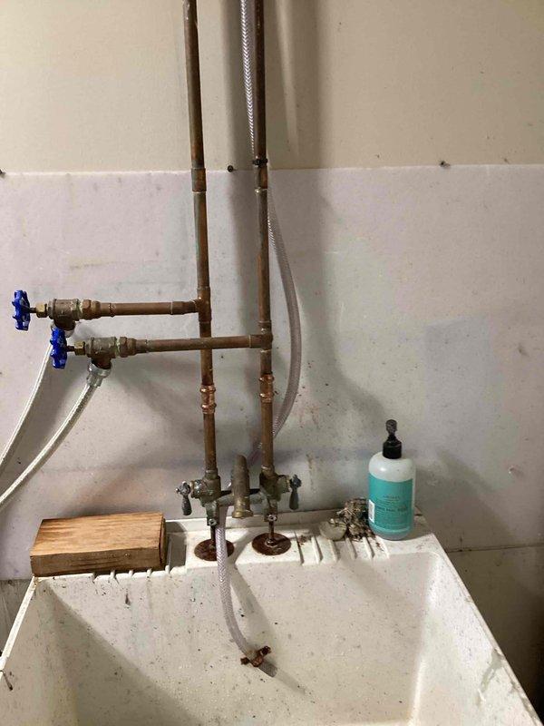 Responded to a loss of water pressure at the bathroom sinks and traced the cause to a failed water softener that released resin beads into the supply piping. Disassembled faucets and supply piping throughout the system and flushed the water lines repeatedly to clear the obstructing resin from the plumbing and restore water flow.
