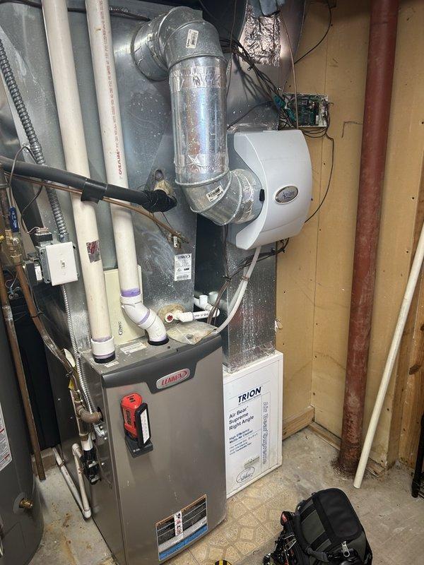 Performed annual maintenance on a 2013 gas furnace, including cleaning the flame sensor and inspecting ignition, burners, blower wheel, inducer motor amperage, flame sensor microamps, gas valve, and gas pressure. Scoped the heat exchanger and found no defects, with safe carbon monoxide levels and combustion results confirming 93.6% efficiency. The system is operating properly. Noted heavy mineral scaling on the humidifier water panel and recommended replacing the filter and humidifier pad to keep up with ongoing maintenance.