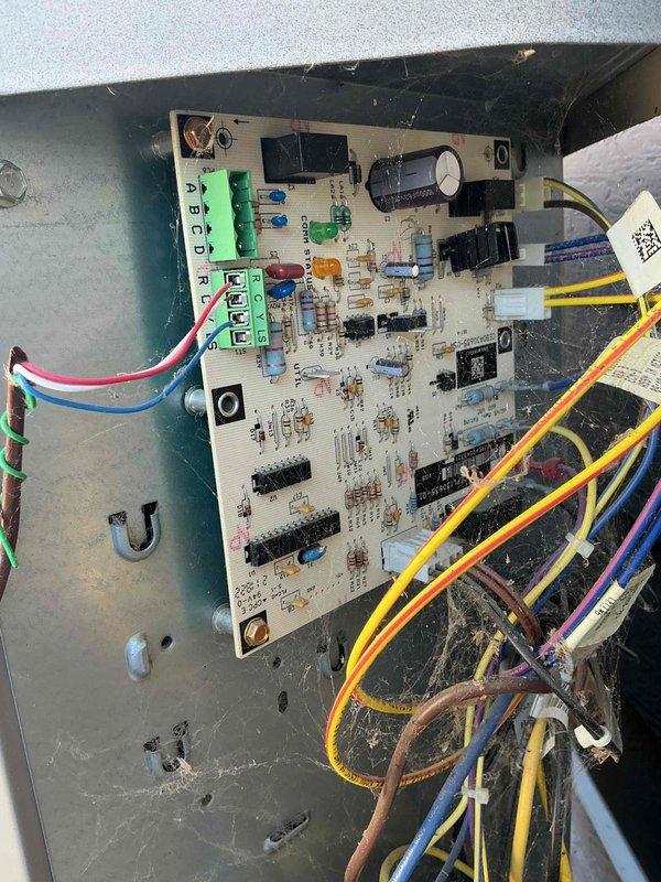 Responded to an install callback for a no-cool complaint; found the air handler blowing air with no cooling due to incorrect low-voltage thermostat wiring at the control board terminal block. Corrected and re-terminated the control wiring (R, C, Y, G) at the board, secured the connections, and verified proper system operation, confirming the installation is complete.
