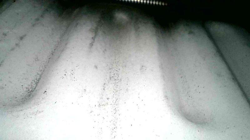Performed a complete furnace tune-up on a Tempstar upright gas furnace, which was found operating properly with no deficiencies. Inspected the condensate drain line, which transitions from 7/8" to 3/4" tubing, and verified it was clear by blowing through it; mineral buildup was noted on the ribbed drain components, and the homeowner was advised it will recur in a couple of years. Homeowner elected to defer replacement of the vinyl drain line at this time.