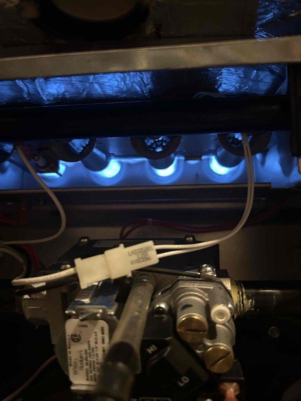 Replaced the defective gas valve with a warranty unit, verified all connections were leak-free, and adjusted manifold gas pressure to specification. Confirmed proper burner ignition with a stable blue flame and normal furnace operation. Customer was unavailable at completion; a voicemail was left, the door was documented, and a follow-up form was submitted.