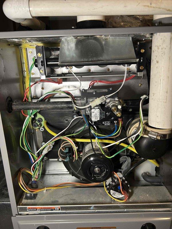 Replaced the defective gas valve with a warranty unit, verified all connections were leak-free, and adjusted manifold gas pressure to specification. Confirmed proper burner ignition with a stable blue flame and normal furnace operation. Customer was unavailable at completion; a voicemail was left, the door was documented, and a follow-up form was submitted.