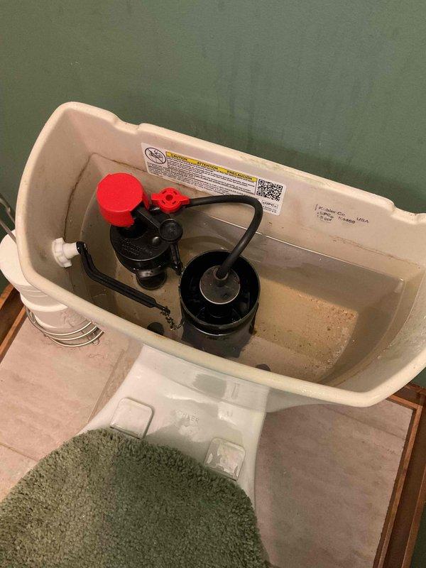 Replaced the fill valves in three toilets that were running and emitting a whistling noise. Installed new fill valves with float cups and adjusted the water level to ensure proper tank refill and shutoff. Confirmed quiet operation and no leaks at the supply connections. Noted mineral sediment and staining inside the tanks, which may warrant future cleaning.