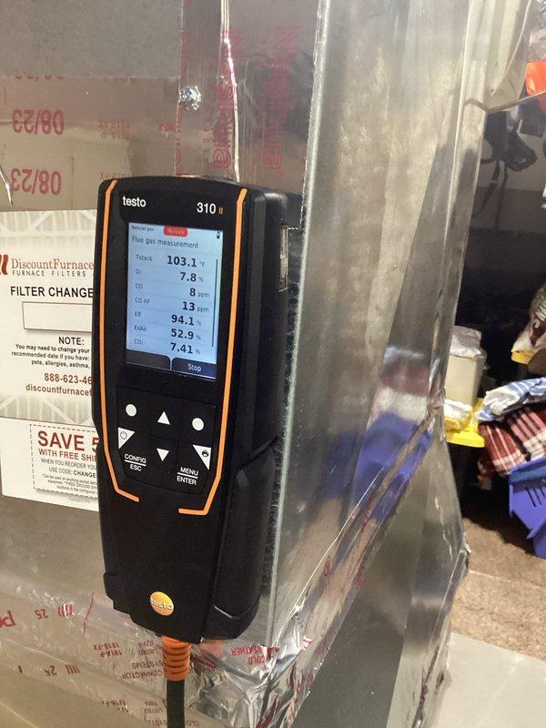 Performed annual heating maintenance on one gas furnace, including a combustion analysis of the flue gases that showed stack temperature of 103.1°F, O2 at 7.8%, CO at 8 ppm (13 ppm air-free), CO2 at 7.41%, and 94.1% efficiency, all within normal operating parameters. Initial heat pump startup failed; adjusted the thermostat settings to restore proper operation and verified the system cycled on correctly. Inspected the air filter and cabinet, noting the foil-faced seal tape at the access panel is wrinkled, peeling, and torn and should be repaired to prevent air leakage.