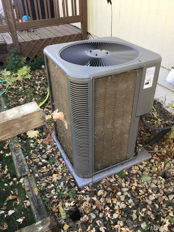 Performed seasonal maintenance on the Lennox gas furnace and split-system air conditioner, confirming both systems were operating properly. Inspected the furnace and evaporator coil cabinet, noting clean, intact equipment with no visible frost, corrosion, or damage, and replaced the furnace filter with the correct size. Found the outdoor condenser coils heavily clogged with dirt, lint, and debris, which should be addressed through coil cleaning to maintain airflow and cooling efficiency.