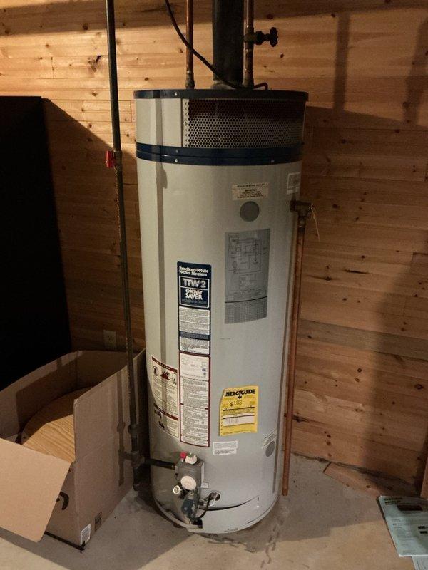 Investigated a reported suspected water leak and elevated water usage by inspecting the water heater and toilet. Diagnosed a continuously running toilet caused by a failed flush valve, which was the source of the water loss, and replaced the flush valve assembly to restore proper tank fill and shutoff operation.