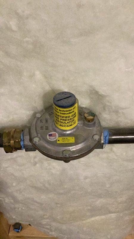 Diagnosed a no-hot-water condition on a one-year-old tankless water heater with an ignition failure and active error code. Gas pressure testing showed a 3" w.c. drop at high fire and combustion analysis showed CO2 slightly outside the acceptable range, indicating a restricted heat exchanger and an undersized gas supply (approximately 5 ft. of gas line where 10 ft. is required). Scheduled an HVAC technician to clean the heat exchanger and extend the gas line.
