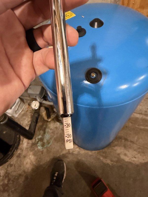 Diagnosed short-cycling at the well pressure tank, where the pump was rapidly oscillating between 48–52 psi and cycling on every couple of hours with no water demand. Found the existing pressure gauge reading inaccurately and the tank air charge approximately 14 psi below the correct setting. Installed a new pressure gauge, drained down the system, and recharged the tank to 38 psi to match the 40/60 pressure switch, restoring proper pump cycling.