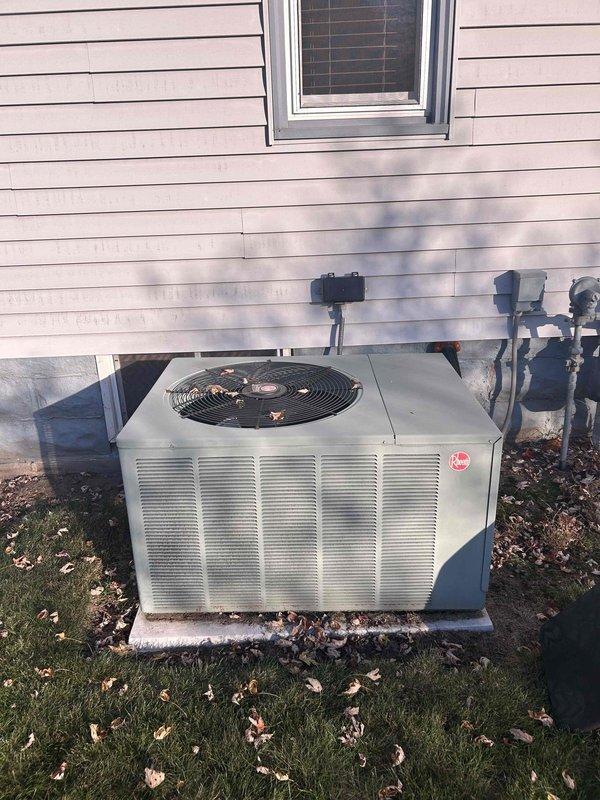 Performed a complete tune-up on the furnace, air conditioning system, and humidifier, inspecting all components for proper mechanical condition and operation. Outdoor condenser unit was visually inspected, with light leaf debris noted on the fan grille and no signs of rust, frost, or physical damage. All equipment was found mechanically sound and operating within normal parameters, with no repairs required.