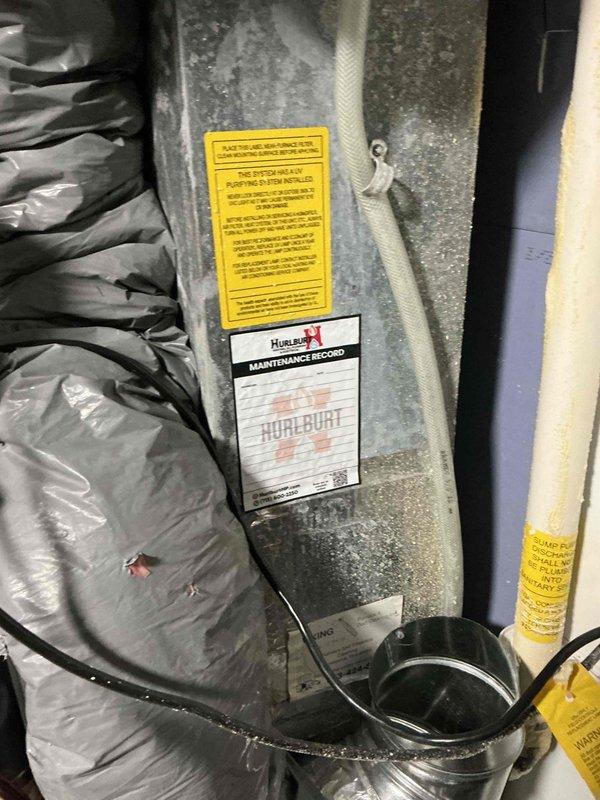 Performed a complete tune-up on a 13-year-old Goodman furnace, verifying ignition and flame safety, gas valve operation, gas pressure, filter condition, blower wheel cleanliness, and control board function, and priming the condensate drain trap. Combustion analysis and temperature rise were within specification; however, flame impingement at the heat exchanger entrance is corroding the front plate, so this area should be monitored for cracking. Recommended relocating nearby shelving and the battery backup to allow clear filter access.