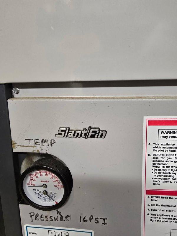 Performed a tune-up and inspection on an older Slant/Fin gas-fired boiler that was underperforming. System pressure was verified at 16 PSI, and a leaking air vent and an expansion tank nearing waterlogged condition were identified, along with surface rust on the unit. Repair and replacement options were presented given the age and condition of the equipment.