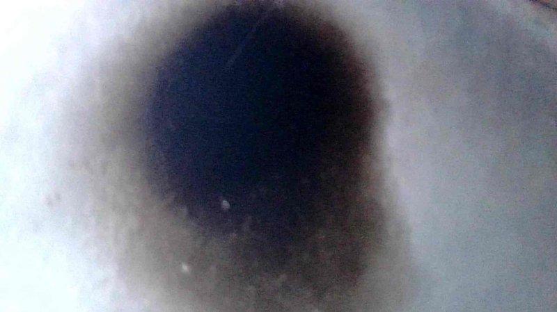 Responded to a no-heat call on a 20-year-old Coleman furnace and found the electric igniter was failing to heat, preventing ignition. Inspected the system, including the burner and flue passage areas where soot and debris deposits were observed, repaired the system, and monitored operation through a heating cycle to confirm proper function.