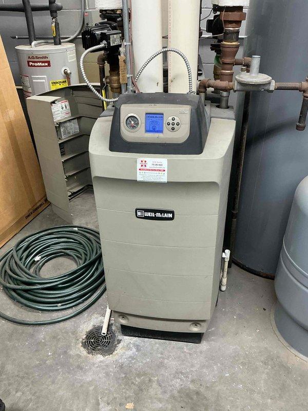 Responded to a complaint of low heat output on two commercial Weil-McLain boilers. Found one unit locked in a maintenance reminder state, reset it, and verified proper operation. Tested all heating zones and restored function, except the office zone, which would not call for heat; a failed zone relay is suspected, and pricing for the repair will be forwarded.