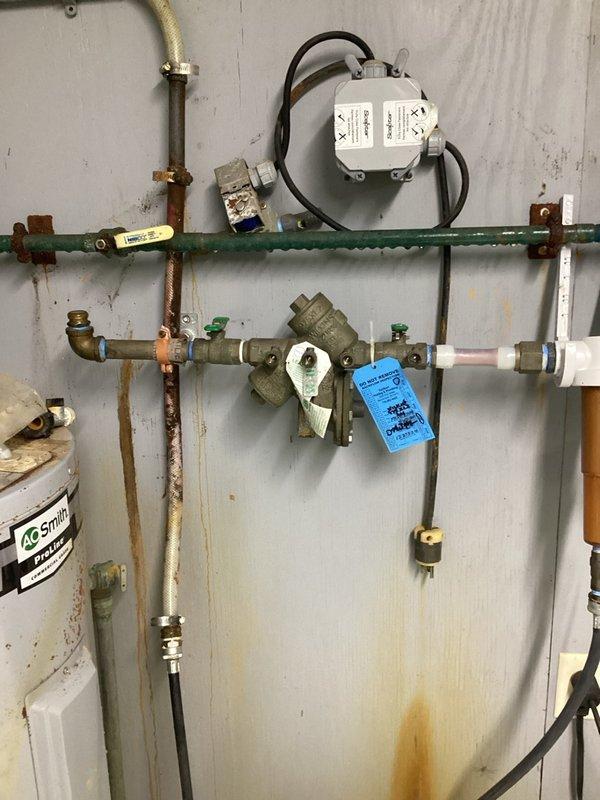Inspected the non-functioning reduced pressure zone (RPZ) backflow preventer on the well water supply and diagnosed a failed No. 2 check valve. The water line was left disconnected from the assembly pending procurement of repair parts, with a return visit required to rebuild the RPZ and restore the supply connection.