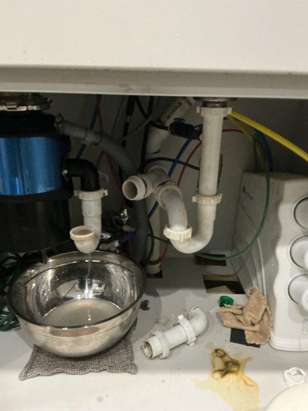 Diagnosed a recurring kitchen sink backup caused by a blockage of food debris and sludge. Disassembled the drain and cabled the line its full length, clearing the obstruction at approximately 30 feet, then ran water while cabling the remainder to flush debris from the line. Reassembled the drain and verified proper drainage with no leaks; recommended replacing the under-sink Studor vent, which has a 10-year service life.