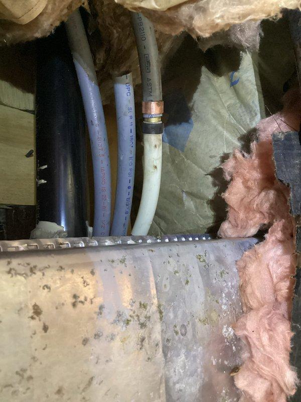 Supplied plumbing materials for residential installation project including PVC piping, copper fittings, and blue PEX tubing. Customer selected components for bathroom renovation requiring connection to existing plumbing system through wall cavity with proper insulation considerations.