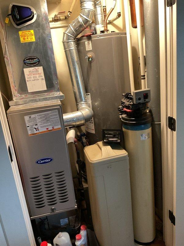 # Service Report: Gas Water Heater - No Hot Water

Responded to service call for gas water heater with no hot water production. Upon arrival, located unit in kitchen utility closet adjacent to furnace system. Performed comprehensive diagnostic inspection of gas-fired water heater, including visual assessment of all major components, gas supply line, pilot assembly, burner operation, and venting system. Inspected associated plumbing connections, temperature and pressure relief valve, and gas control valve functionality. Evaluated exhaust venting for proper draft and clearance. Documented existing conditions of water heater and surrounding mechanical systems, including adjacent HVAC equipment and water treatment system. Completed troubleshooting procedures to identify cause of hot water failure and provided recommendations for restoration of service.