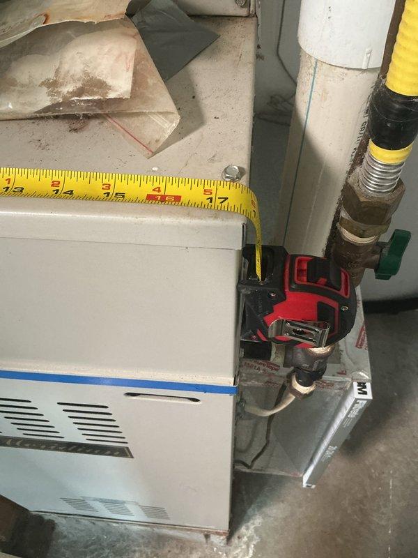 Responded to service call for HVAC system replacement estimate at residential property. Upon arrival, accessed equipment through back entrance and conducted thorough assessment of existing heating and cooling system. Evaluated current Robertshaw digital thermostat displaying operational status and inspected basement-mounted furnace unit with associated hydronic heating components including circulation pump, PVC condensate piping, and supply/return connections. Documented equipment age, condition, and configuration through photographs. Measured existing unit dimensions to determine replacement specifications and reviewed available space for new equipment installation. Assessed electrical service, gas connections, ductwork accessibility, and existing piping infrastructure to provide comprehensive replacement options. Prepared estimate for complete system replacement with appropriate equipment sizing recommendations based on current installation parameters.