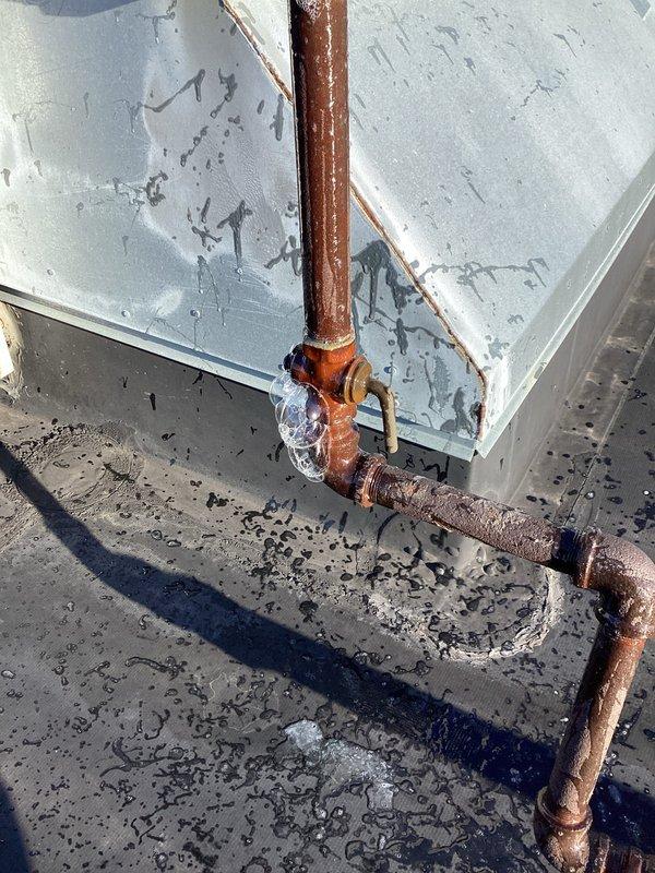 Responded to service call for gas line leak repair on rooftop HVAC installation. Upon arrival, utility company had gas meter pinned due to detected leaks in the system. Performed pressure test on gas piping to identify leak locations in the copper gas line assembly. Located leaks at multiple joints and fittings in the weathered copper piping system serving the rooftop unit. Repaired compromised connections and joints, replaced faulty fittings as needed, and re-pressurized the gas line to manufacturer specifications. Verified system integrity with pressure gauge monitoring, confirming all leaks were successfully sealed and system maintained proper pressure. Coordinated with utility company for meter restoration and system reactivation upon completion of repairs.