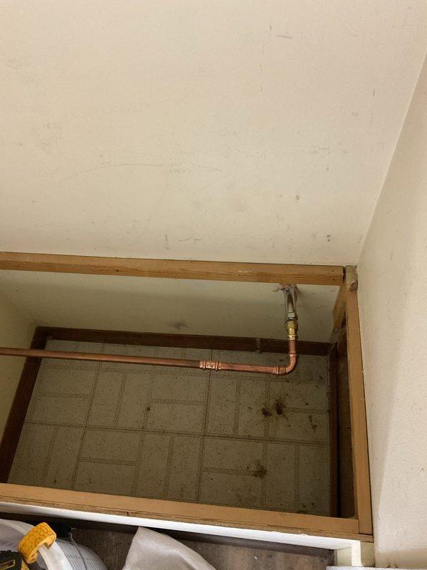 Performed routine maintenance on tanked gas water heater located in garage, including complete tank flush to remove sediment buildup and ensure optimal heating efficiency. Inspected plumbing connections and brass fittings on copper supply lines for proper operation. Assessed exterior hose bibs and noted existing leakage conditions on both front and rear spigots for potential future replacement.