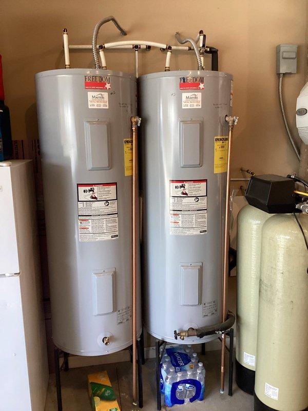 Completed plumbing maintenance visit including water heater flush on one Freedom-brand tanked water heater. Performed standard flush procedure to remove sediment buildup and maintain unit efficiency. Inspected second water heater on-site but did not service per customer request. Assessed toilet in second bedroom and confirmed unit is loose and rocking at base, requiring reinstallation or wax ring replacement at future appointment.