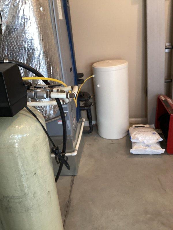 Completed plumbing maintenance visit including water heater flush on one Freedom-brand tanked water heater. Performed standard flush procedure to remove sediment buildup and maintain unit efficiency. Inspected second water heater on-site but did not service per customer request. Assessed toilet in second bedroom and confirmed unit is loose and rocking at base, requiring reinstallation or wax ring replacement at future appointment.