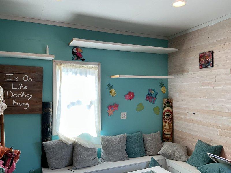 Conducted on-site evaluation for mini-split system installation in detached multi-level pool house structure. Customer requested 12,000 BTU capacity unit for climate control. Assessed existing four-season room area containing older wall-mounted PTAC or mini-split unit of questionable operational status requiring further discussion regarding potential replacement or integration with new system. Documented interior space dimensions, wall configurations, and existing HVAC equipment through photographic documentation to determine optimal equipment sizing and installation approach.