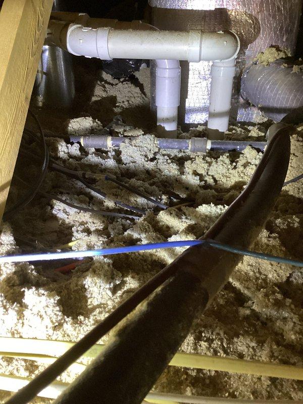 Replaced defective 2-inch elbow fitting on furnace flue system located in attic space. Installed two 2-inch couplings and one 2-inch 90-degree elbow to restore proper venting configuration. All PVC connections were properly fitted and secured to ensure safe exhaust ventilation from the heating unit.