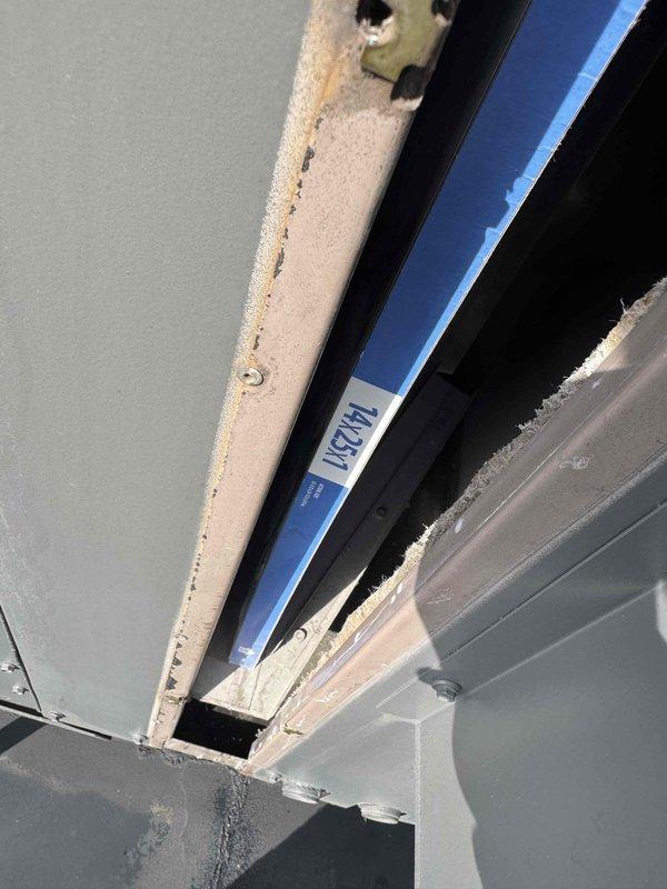 Performed initial assessment of furnace system in attic space. Identified access constraints preventing completion of thermostat wiring installation. Inspected HVAC unit and documented equipment details, including belt component showing wear on Megadyne MXV2-940 belt. Determined that thermostat wiring location needs to be traced before proper installation can proceed. Scheduled return visit with technician capable of accessing confined attic space to complete thermostat wiring and installation work.
