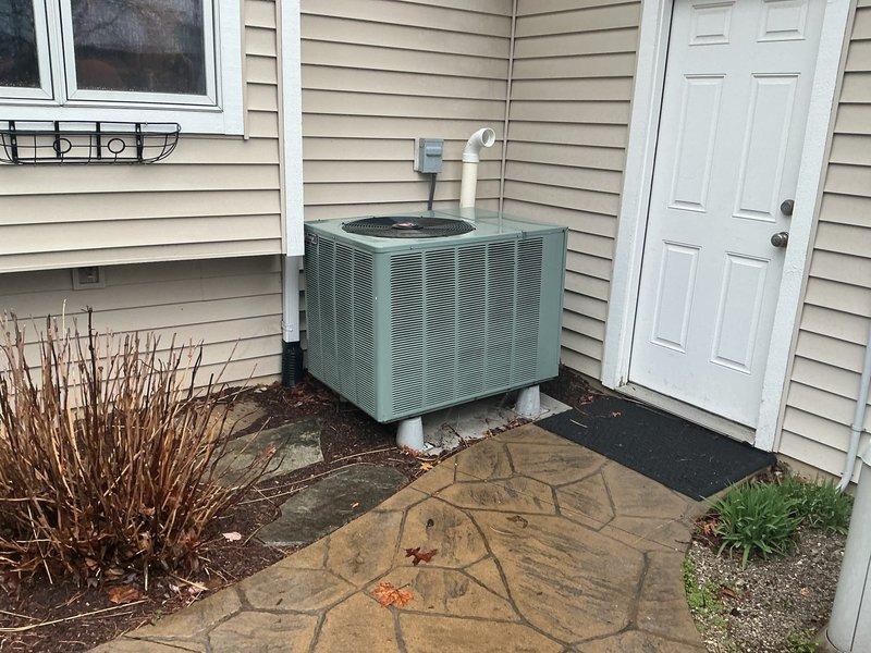 Conducted on-site evaluation of non-operational air conditioning system while furnace remained functional. Assessed existing teal-colored outdoor condensing unit and indoor HVAC system components including gray Rheem furnace with connected ductwork, humidifier, and PVC condensate drainage. Documented current equipment condition through photographic records of both basement installation and exterior unit placement. Provided comprehensive replacement estimate for AC unit only, as furnace system was verified to be operating properly and did not require replacement at this time.