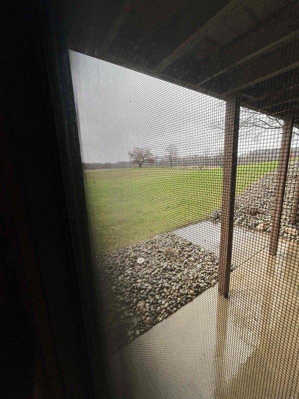 Conducted on-site assessment of existing HVAC system located in unfinished basement utility area for equipment replacement estimate. Documented current installation conditions including aged air handler unit with visible dust accumulation, exposed ductwork, and utility infrastructure. Evaluated accessibility for equipment removal and new system installation, noting concrete floor conditions, existing plumbing lines, electrical routing along wall studs, and available clearances for proper equipment placement and service access.