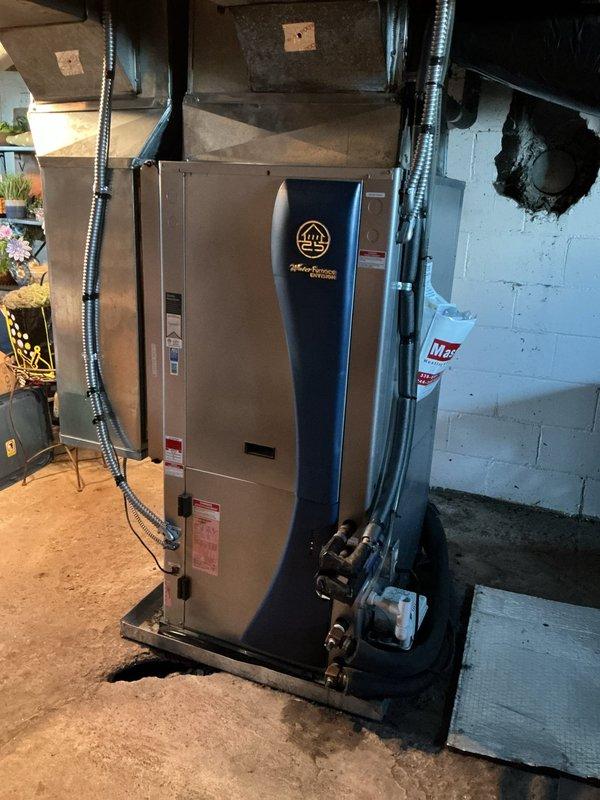 Completed comprehensive geothermal system tune-up and cooling season preparation on water-source heat pump with GeoLINK ground loop circulation pumps. Performed full system inspection, verified proper operation of dual circulation pumps, checked refrigerant pressures, inspected all electrical connections and conduit routing, and confirmed air handler integration with geothermal unit functioning correctly for optimal cooling performance.