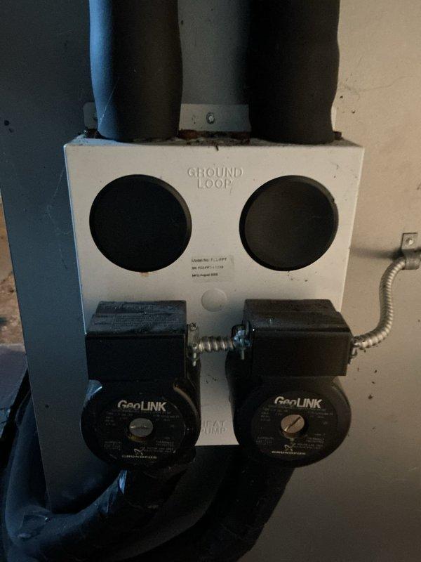 Completed comprehensive geothermal system tune-up and cooling season preparation on water-source heat pump with GeoLINK ground loop circulation pumps. Performed full system inspection, verified proper operation of dual circulation pumps, checked refrigerant pressures, inspected all electrical connections and conduit routing, and confirmed air handler integration with geothermal unit functioning correctly for optimal cooling performance.