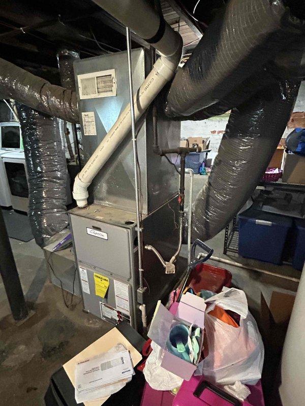 Conducted assessment for HVAC system expansion to second-story living space converted from attic. Evaluated existing basement furnace and ductwork configuration to determine feasibility of extending supply ducts to upper level, as current system provides minimal to no heating and cooling to converted space. Documented existing equipment and duct routing, noting complex basement ductwork network and limited accessibility through converted attic area, and provided estimate for new supply duct installation from basement to second floor.
