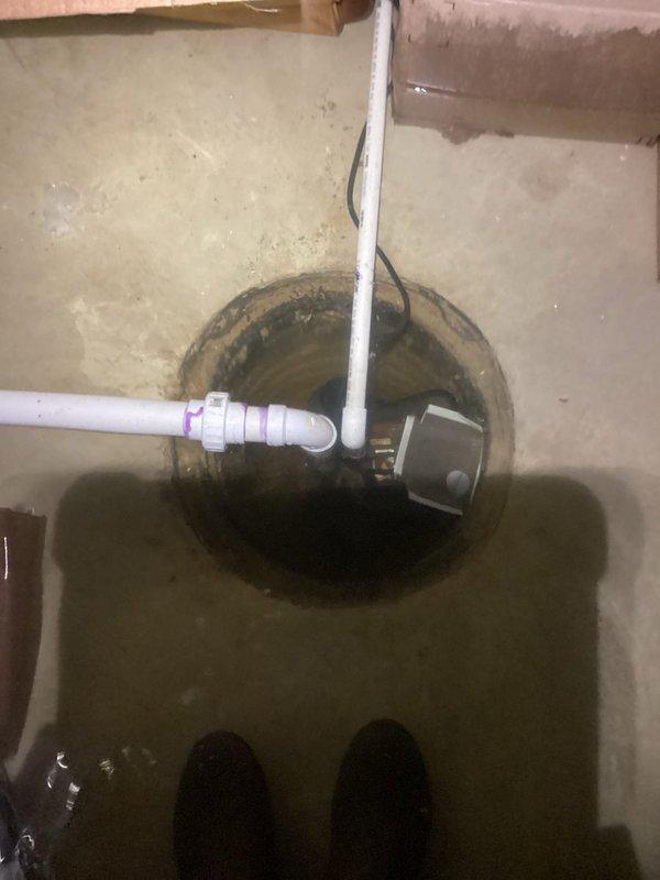 Responded to emergency call for failed sump pump with 6-8 inches of standing water in basement. Upon arrival, extracted standing water and assessed existing sump pump system. Determined primary pump had failed and required replacement. Installed new sump pump unit in existing pit with proper discharge piping configuration using PVC components. Connected system to existing pressure tank and copper discharge line with appropriate fittings and shutoff valve. Verified proper float operation and pump cycling. Tested complete system under load to ensure adequate water removal capacity and confirmed proper discharge through exterior line. System restored to full operational status with no standing water remaining in basement.