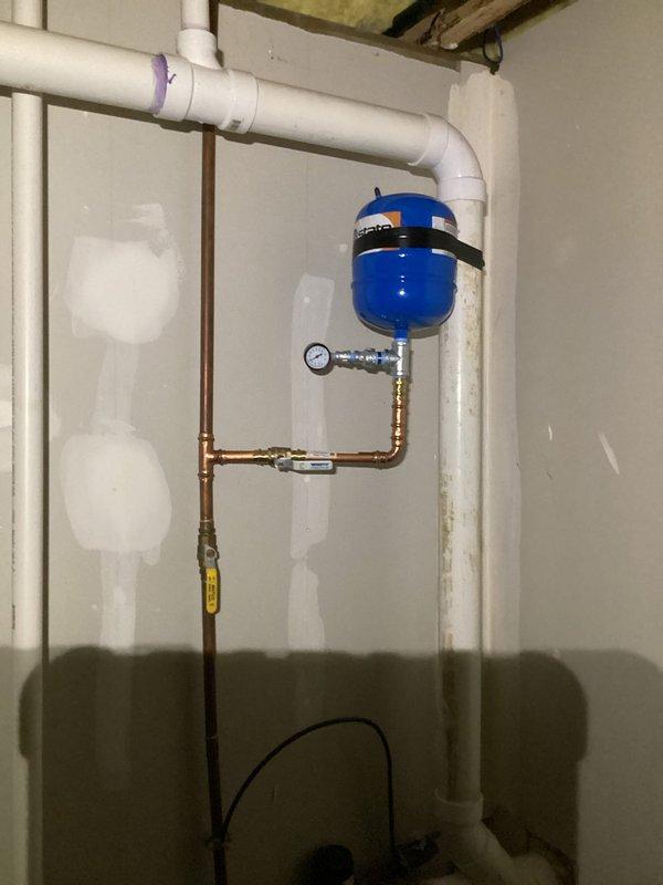 Responded to emergency call for failed sump pump with 6-8 inches of standing water in basement. Upon arrival, extracted standing water and assessed existing sump pump system. Determined primary pump had failed and required replacement. Installed new sump pump unit in existing pit with proper discharge piping configuration using PVC components. Connected system to existing pressure tank and copper discharge line with appropriate fittings and shutoff valve. Verified proper float operation and pump cycling. Tested complete system under load to ensure adequate water removal capacity and confirmed proper discharge through exterior line. System restored to full operational status with no standing water remaining in basement.